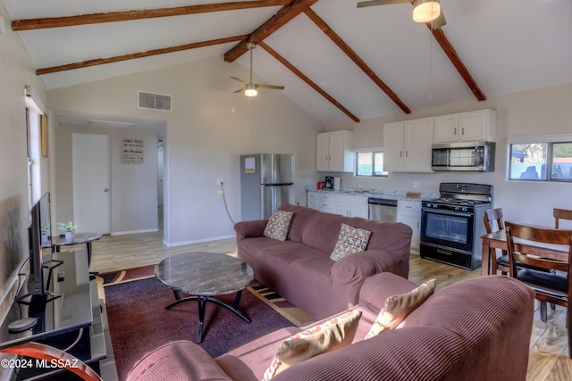 living room featuring beamed ceiling, ceiling fan, and high vaulted ceiling