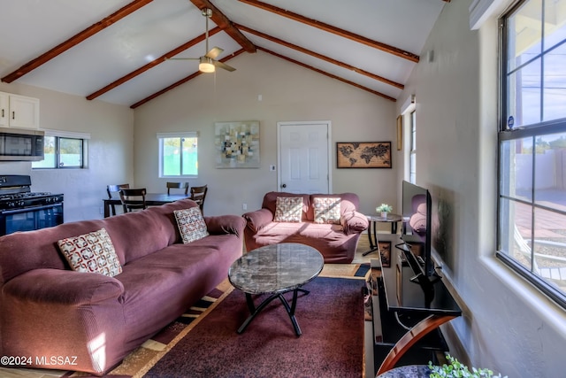 living room featuring beamed ceiling, ceiling fan, and high vaulted ceiling