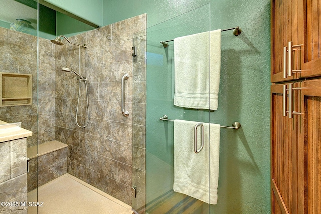 bathroom featuring a shower with door