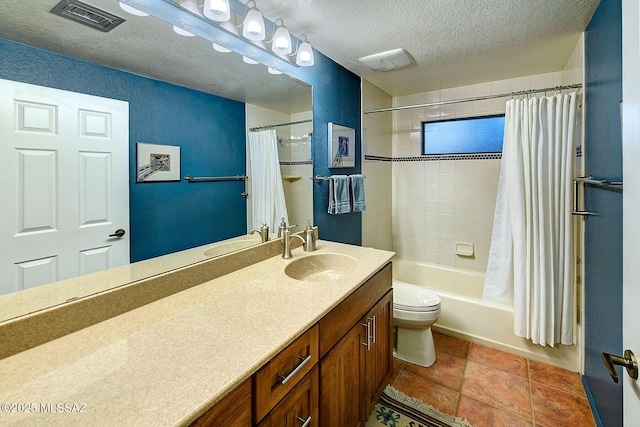 full bathroom featuring shower / bath combo with shower curtain, vanity, a textured ceiling, and toilet