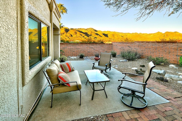 view of patio / terrace with a mountain view