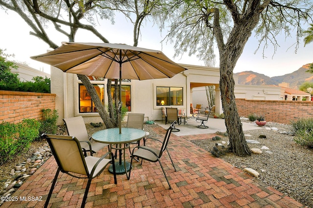 view of patio / terrace featuring a mountain view