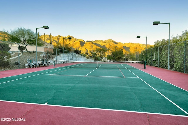 view of sport court with a mountain view and basketball court