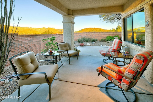 view of patio / terrace with a mountain view