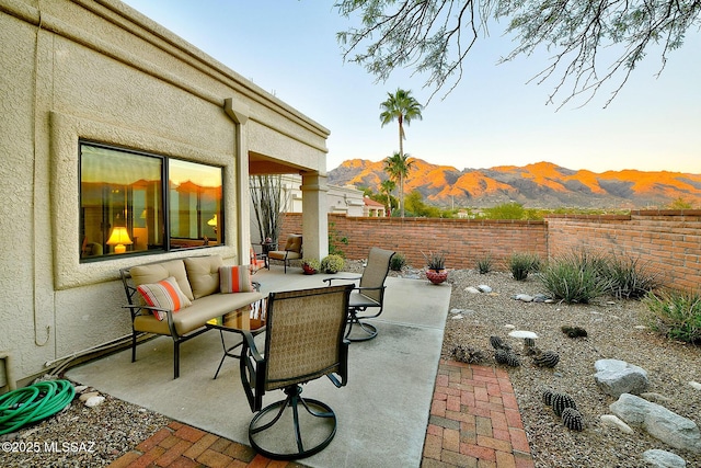 view of patio / terrace featuring a mountain view