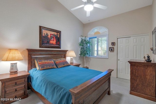 bedroom featuring ceiling fan, a closet, high vaulted ceiling, and light colored carpet