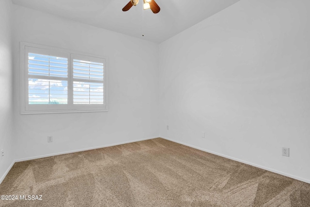 unfurnished room featuring carpet flooring and ceiling fan