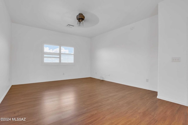 empty room featuring dark wood-type flooring