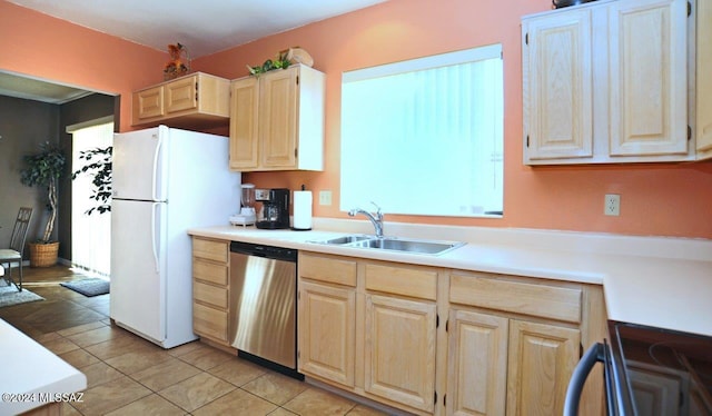 kitchen featuring light brown cabinets, white refrigerator, sink, stainless steel dishwasher, and light tile patterned flooring