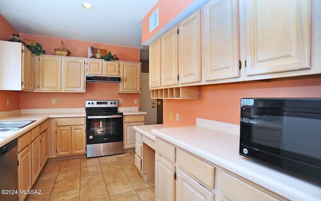 kitchen featuring sink, stainless steel appliances, and light tile patterned flooring