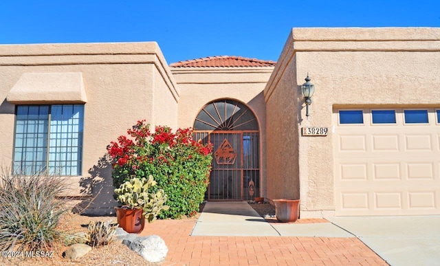 property entrance featuring a garage