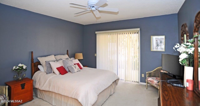 bedroom featuring ceiling fan and light carpet