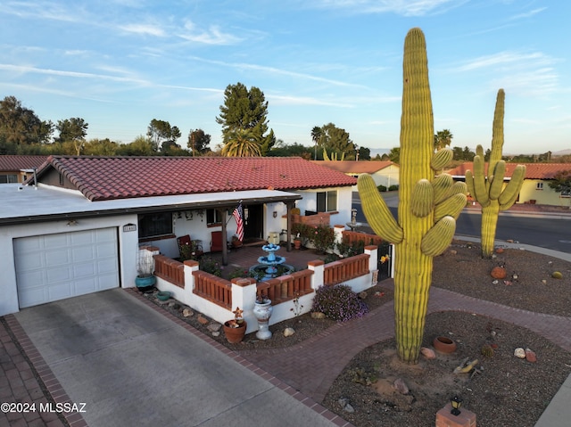 single story home with a garage