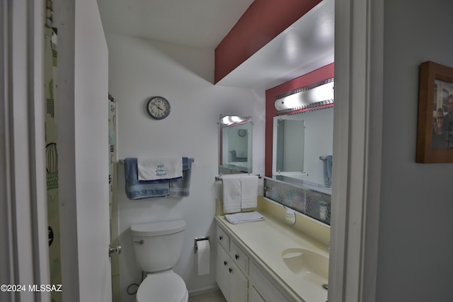 bathroom with vanity and toilet