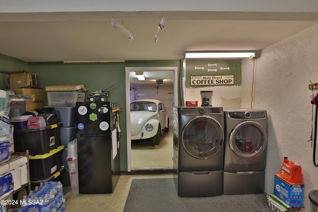 laundry area with independent washer and dryer