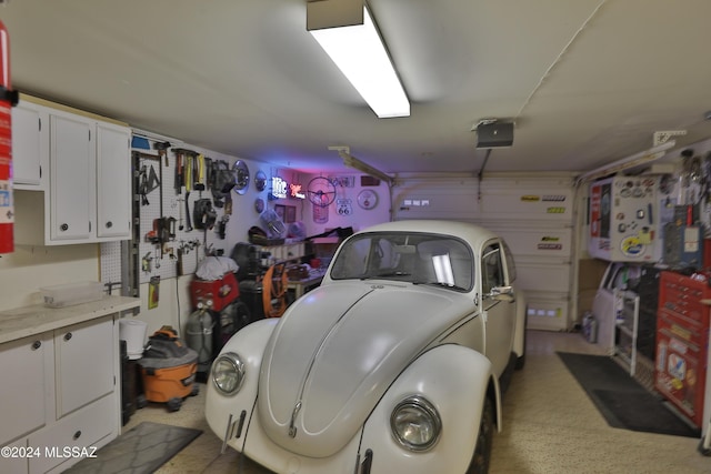 garage featuring a workshop area and a garage door opener