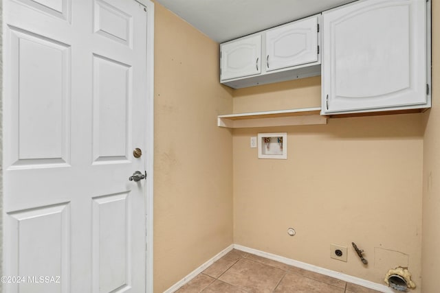 laundry area featuring cabinets, hookup for a gas dryer, washer hookup, light tile patterned floors, and hookup for an electric dryer