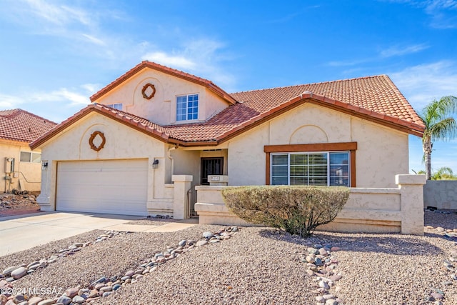 mediterranean / spanish-style home with a garage