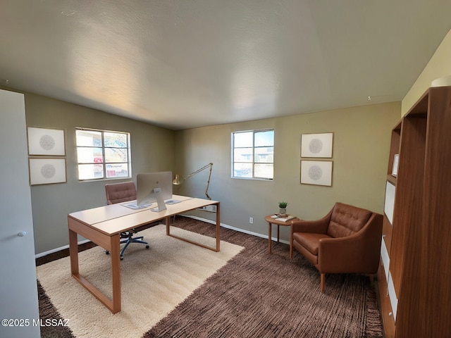 carpeted office featuring vaulted ceiling