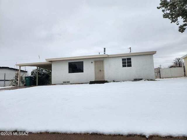 view of snow covered house