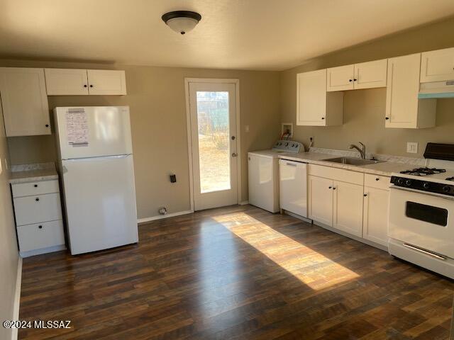 kitchen with white appliances, dark hardwood / wood-style floors, white cabinetry, and sink