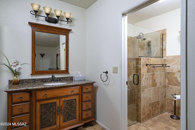 bathroom featuring vanity and a shower with door