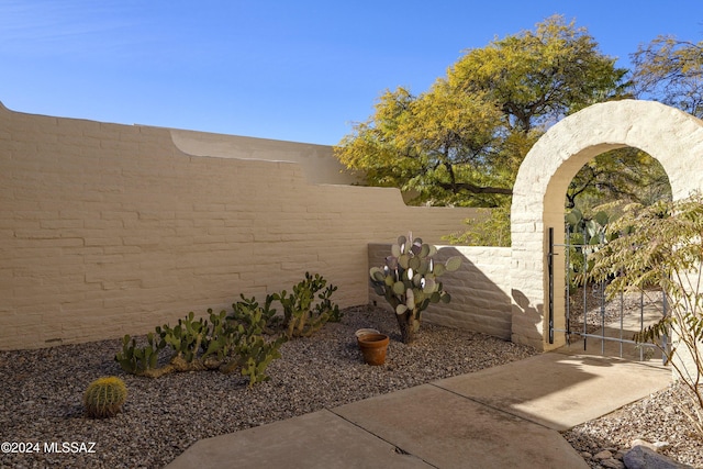 view of yard featuring fence private yard and a gate