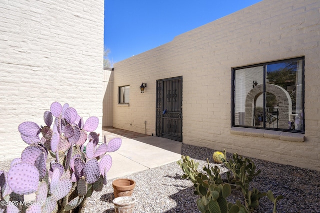 property entrance with a patio area