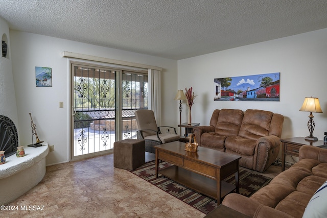 living room with a textured ceiling