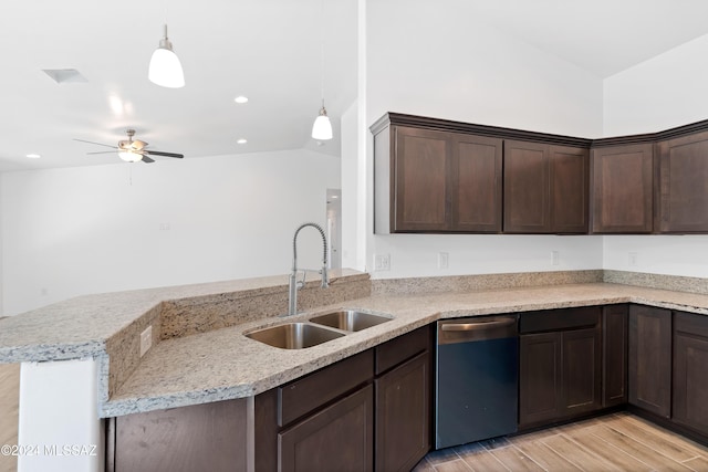 kitchen with stainless steel dishwasher, pendant lighting, light wood-type flooring, and sink