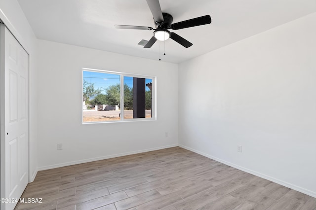 interior space featuring ceiling fan and light wood-type flooring