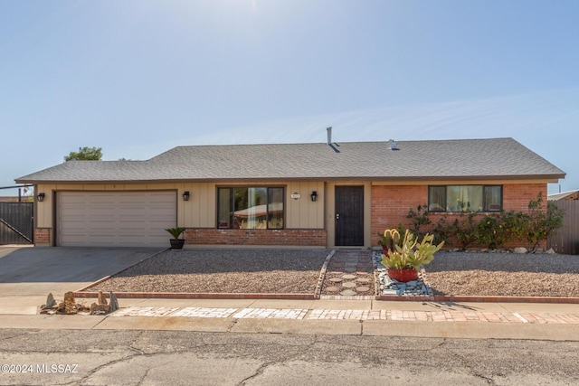 single story home featuring a garage