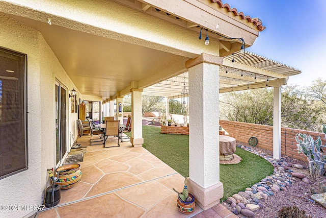 view of patio featuring a pergola