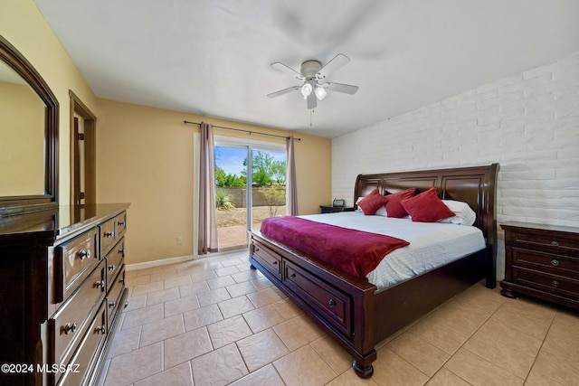 tiled bedroom featuring brick wall, access to outside, and ceiling fan