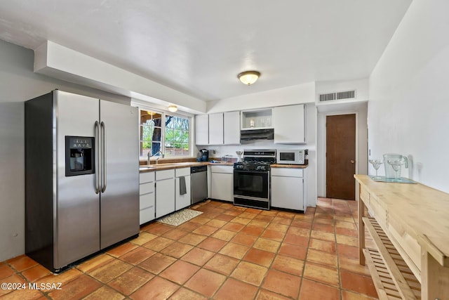 kitchen with stainless steel appliances and white cabinets