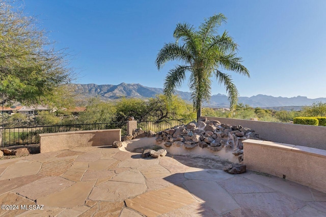 view of patio / terrace featuring a mountain view