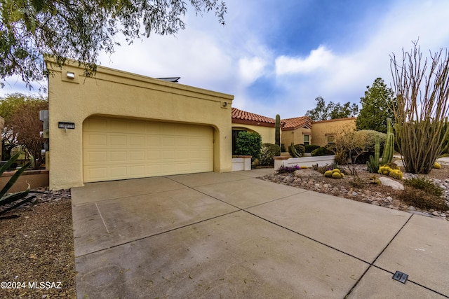 view of front of home with a garage