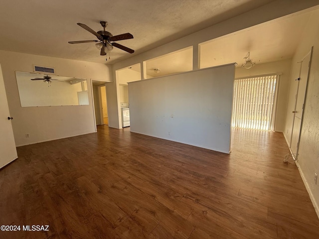 spare room featuring ceiling fan and dark hardwood / wood-style flooring