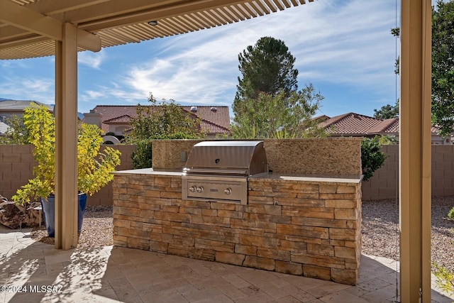 view of patio featuring exterior kitchen and area for grilling