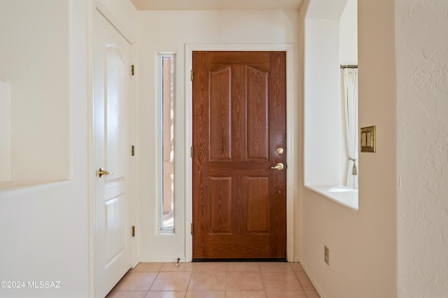 doorway featuring light tile patterned floors