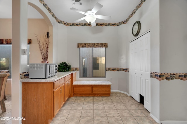 bathroom featuring tile patterned flooring and ceiling fan