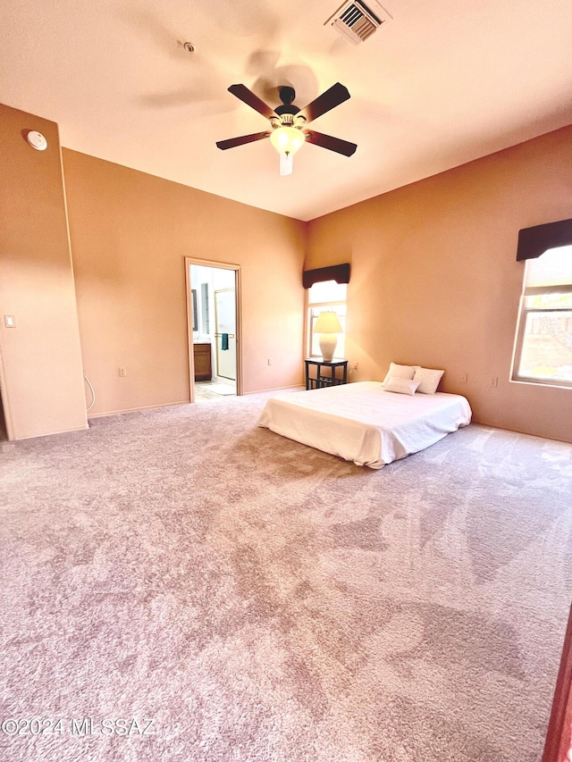 unfurnished bedroom featuring carpet and ceiling fan