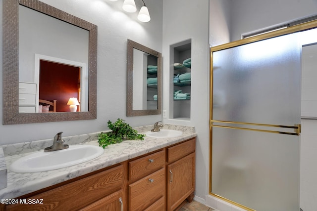 bathroom with vanity and an enclosed shower