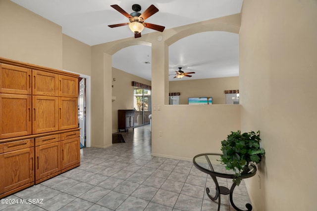 interior space featuring ceiling fan