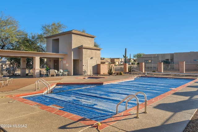 view of swimming pool with a patio area