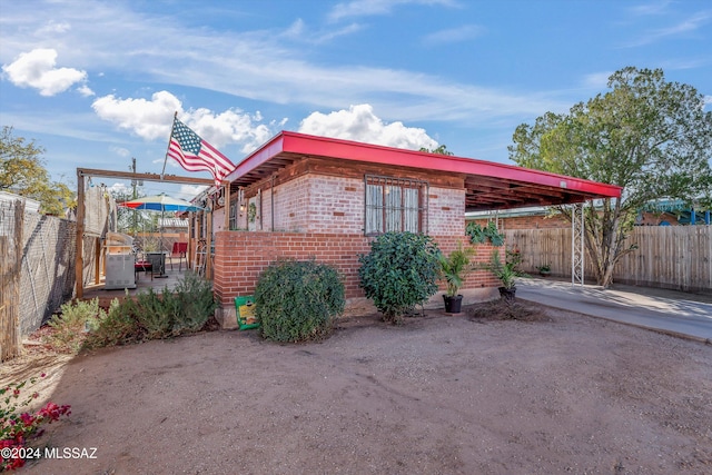 view of property exterior featuring a patio