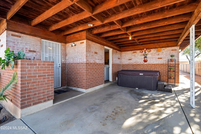 view of patio with a hot tub