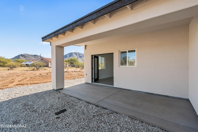 view of patio / terrace with a mountain view