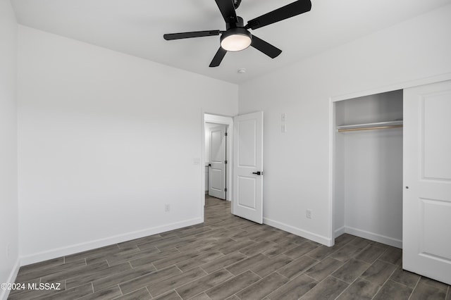 unfurnished bedroom featuring ceiling fan, dark wood-type flooring, and a closet