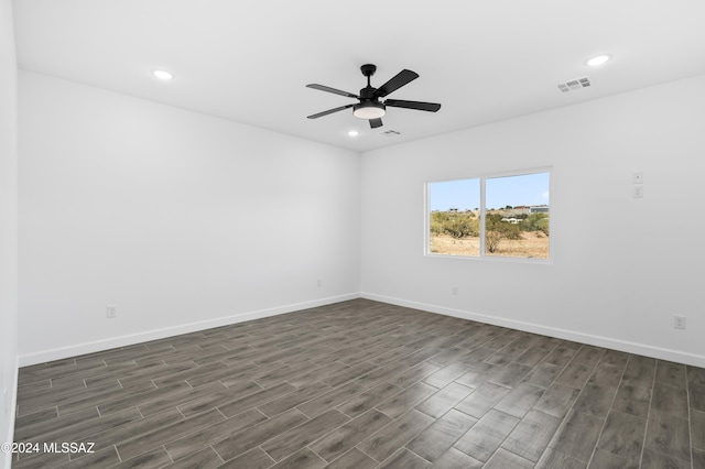 unfurnished room with dark hardwood / wood-style floors and ceiling fan